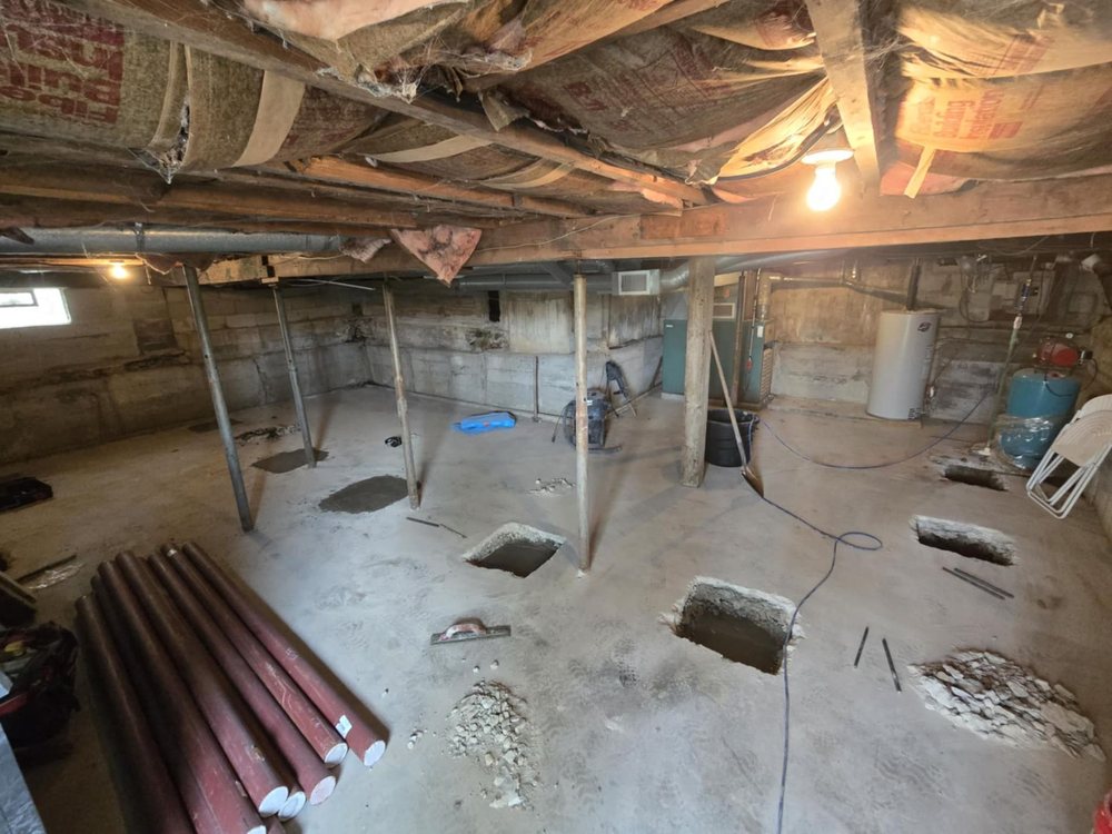 Lally column supporting a basement beam
